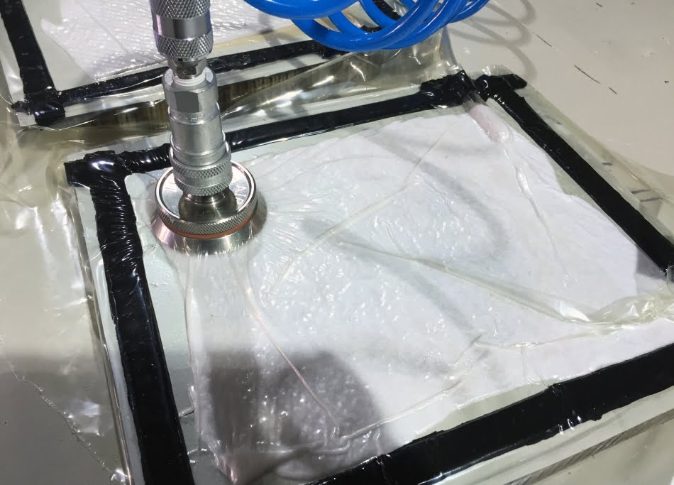 Vacuum application prior to the curing process of repaired carbon-fiber sandwich panel. Photo: ICRIT